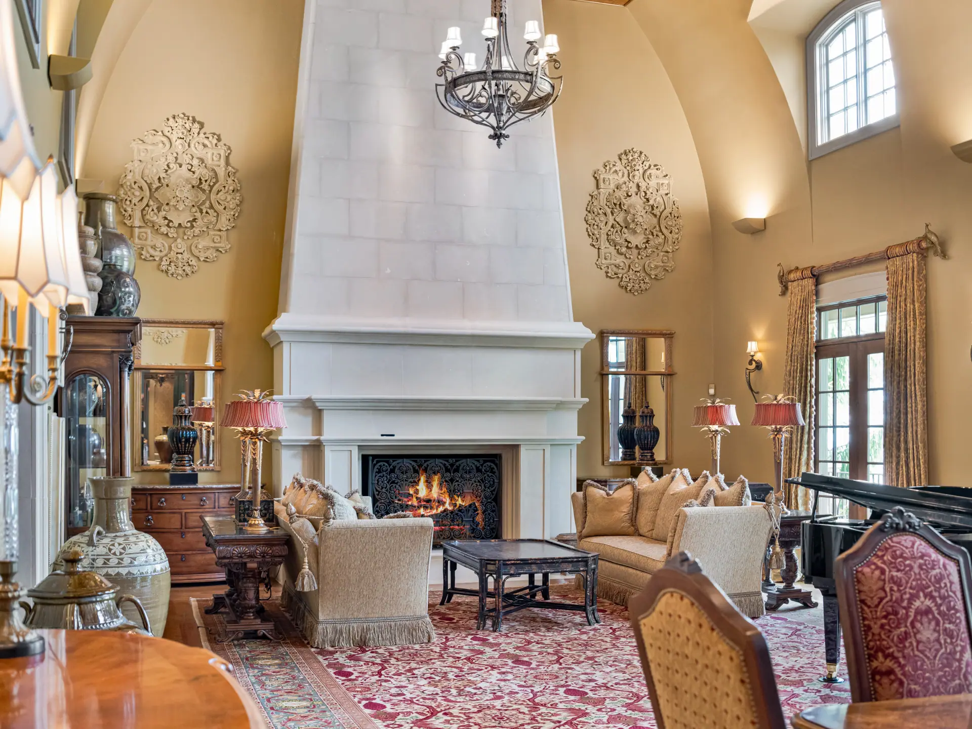 Great room with Italian limestone fireplace and chandelier